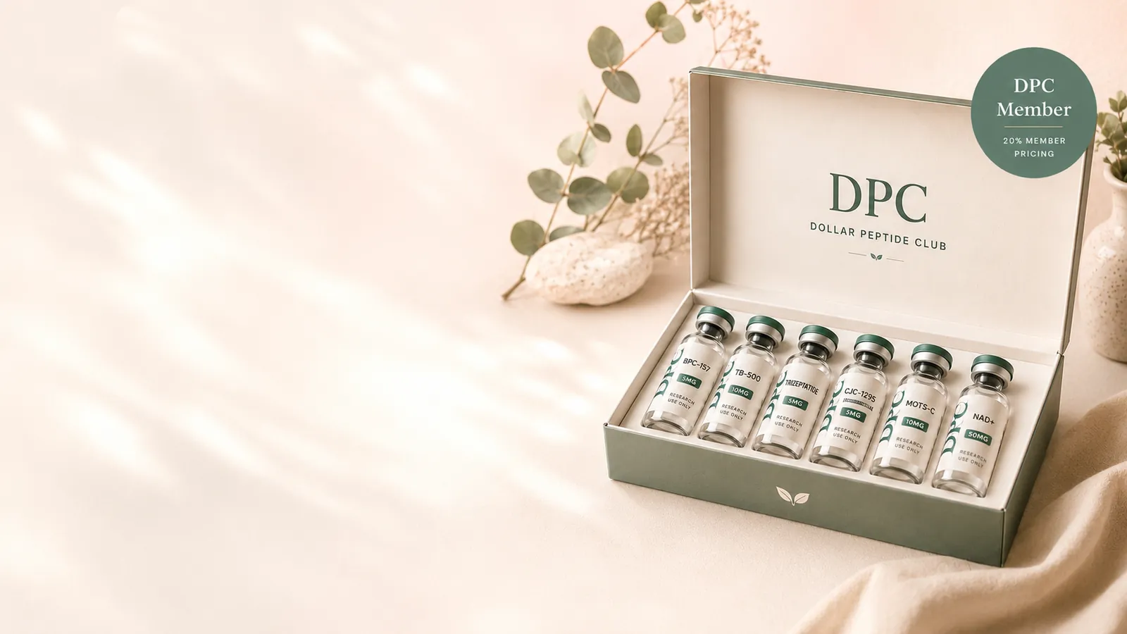 Dollar Peptide Club box with a research vial and eucalyptus sprig